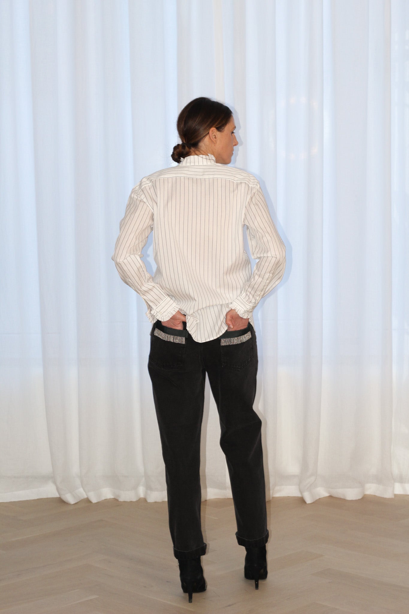 Our FLO black stripes shirt is the grungy romantic shirt that will fit your wildest mood. Straight fit, with raw cut ruffles at the collar, sleeves cuffs, and a blind front placket. Designed in a straight fit, it’s true to size—size up if you prefer a looser look. Produced in Portugal in limited quantities.