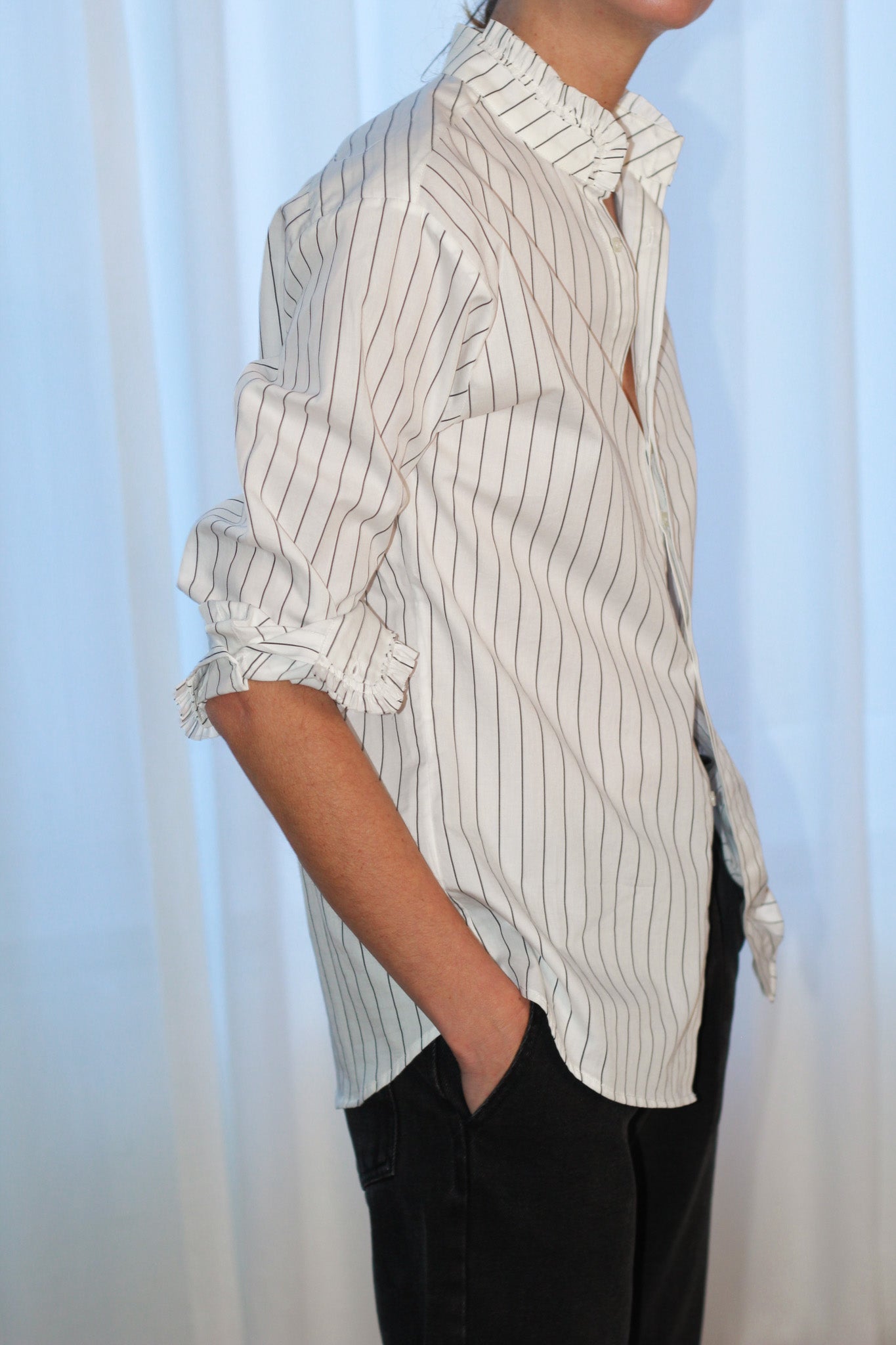 Our FLO black stripes shirt is the grungy romantic shirt that will fit your wildest mood. Straight fit, with raw cut ruffles at the collar, sleeves cuffs, and a blind front placket. Designed in a straight fit, it’s true to size—size up if you prefer a looser look. Produced in Portugal in limited quantities.
