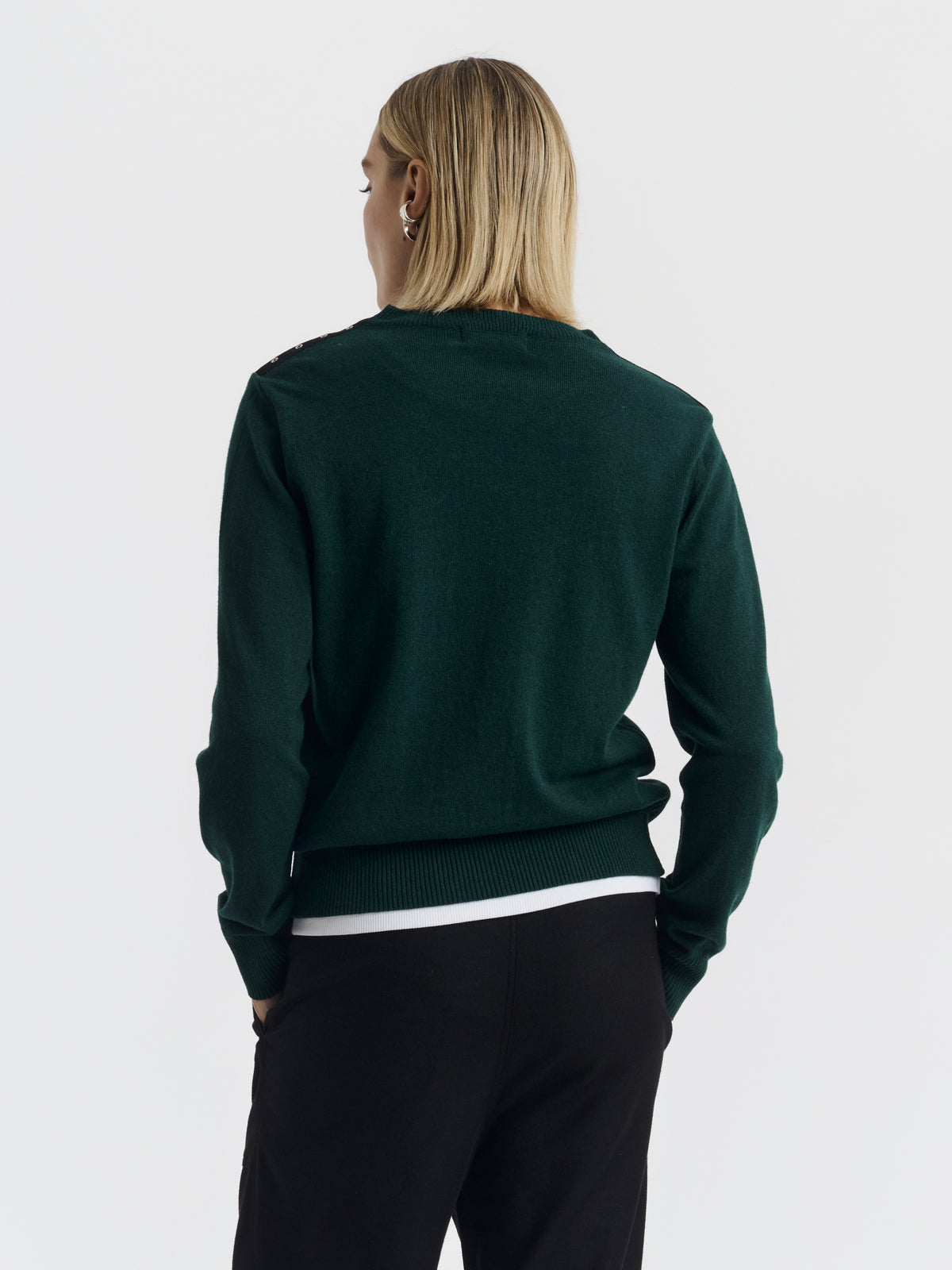 Dark green ISA CHAINS jumper worn, back view