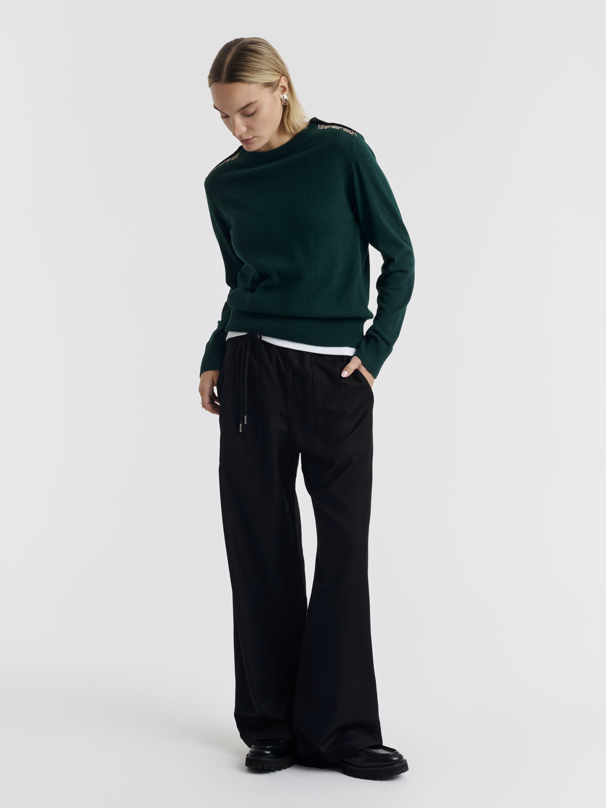Dark green ISA CHAINS jumper worn, front view