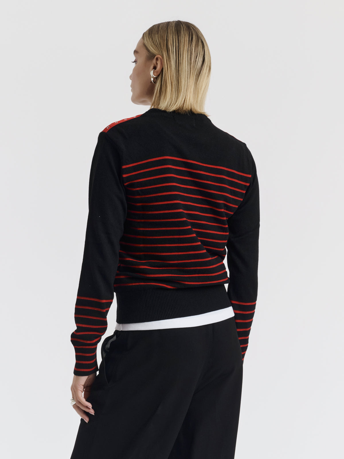 Red and black ISA CHAINS jumper worn, back view