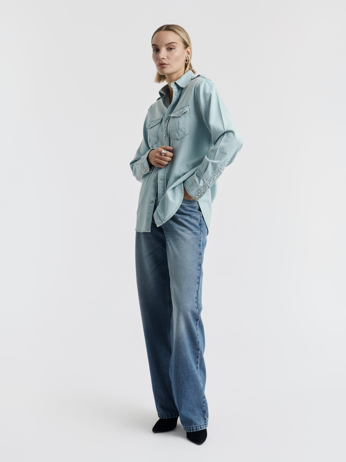 Light blue denim TITI shirt worn, front view.