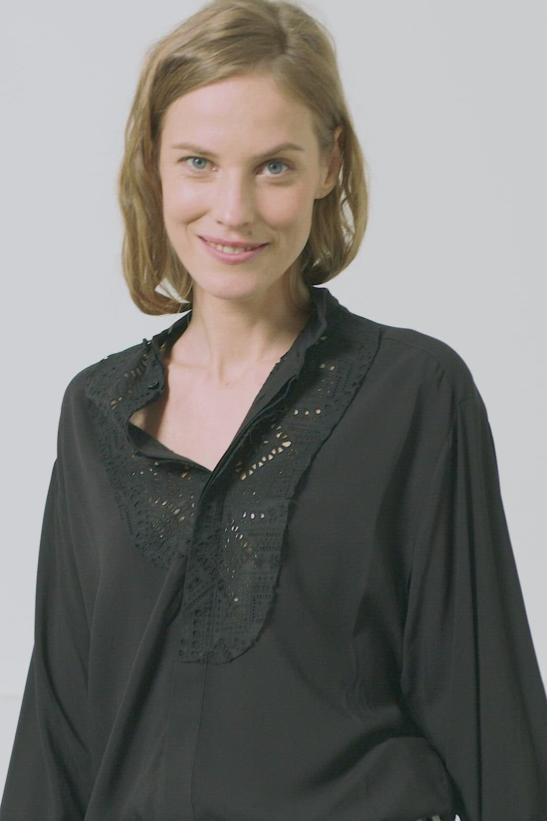 Fluid women's black smoking shirt with broderie anglaise, application smoking cuffs with self covered buttons Black viscose with black cotton broderie anglaise. Made in Portugal