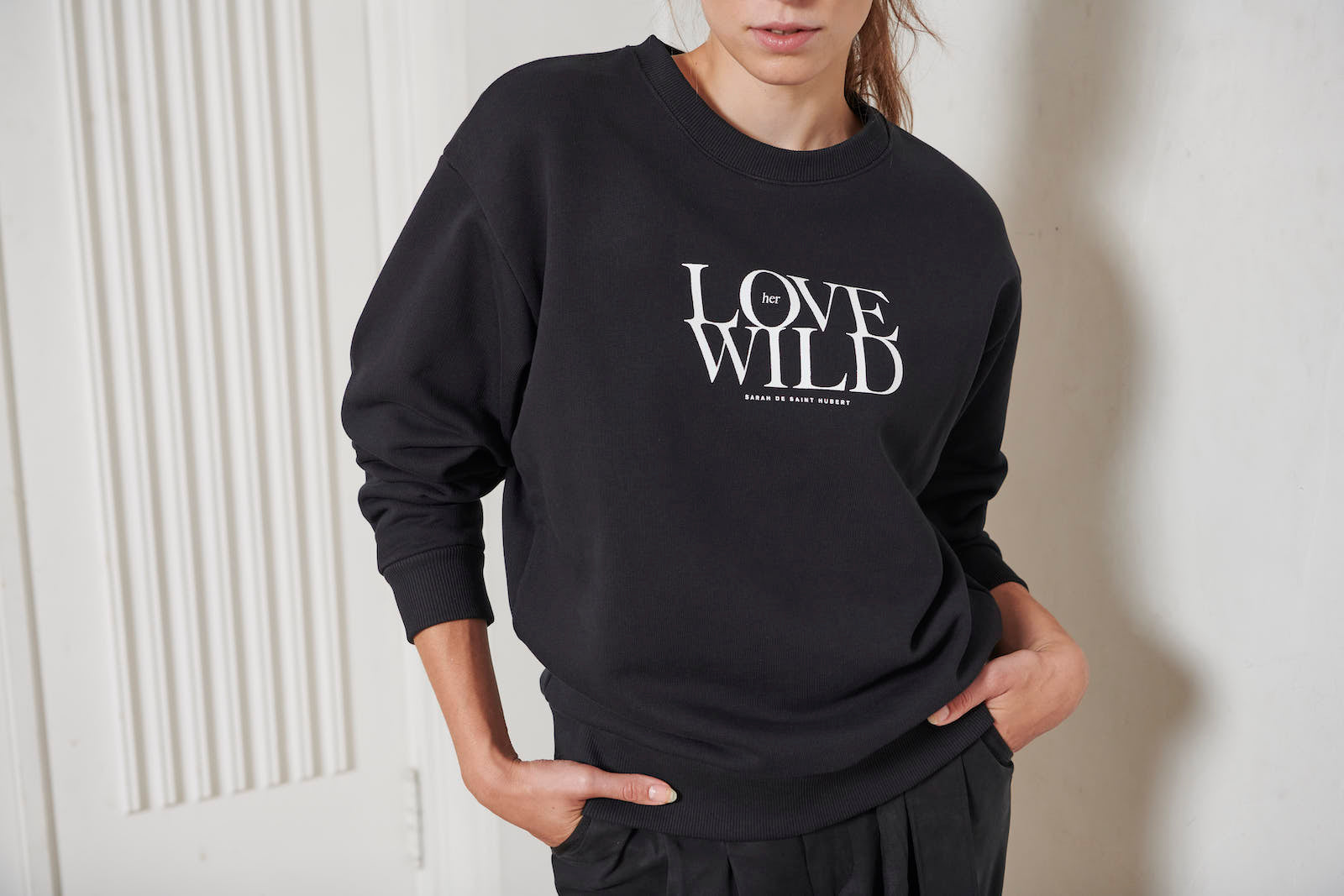 SARAH DE SAINT HUBERT relaxed fit sweatshirt, featuring our signature 'Love her Wild' print. Made from a 100% cotton fleece, colour black. Made in Portugal
