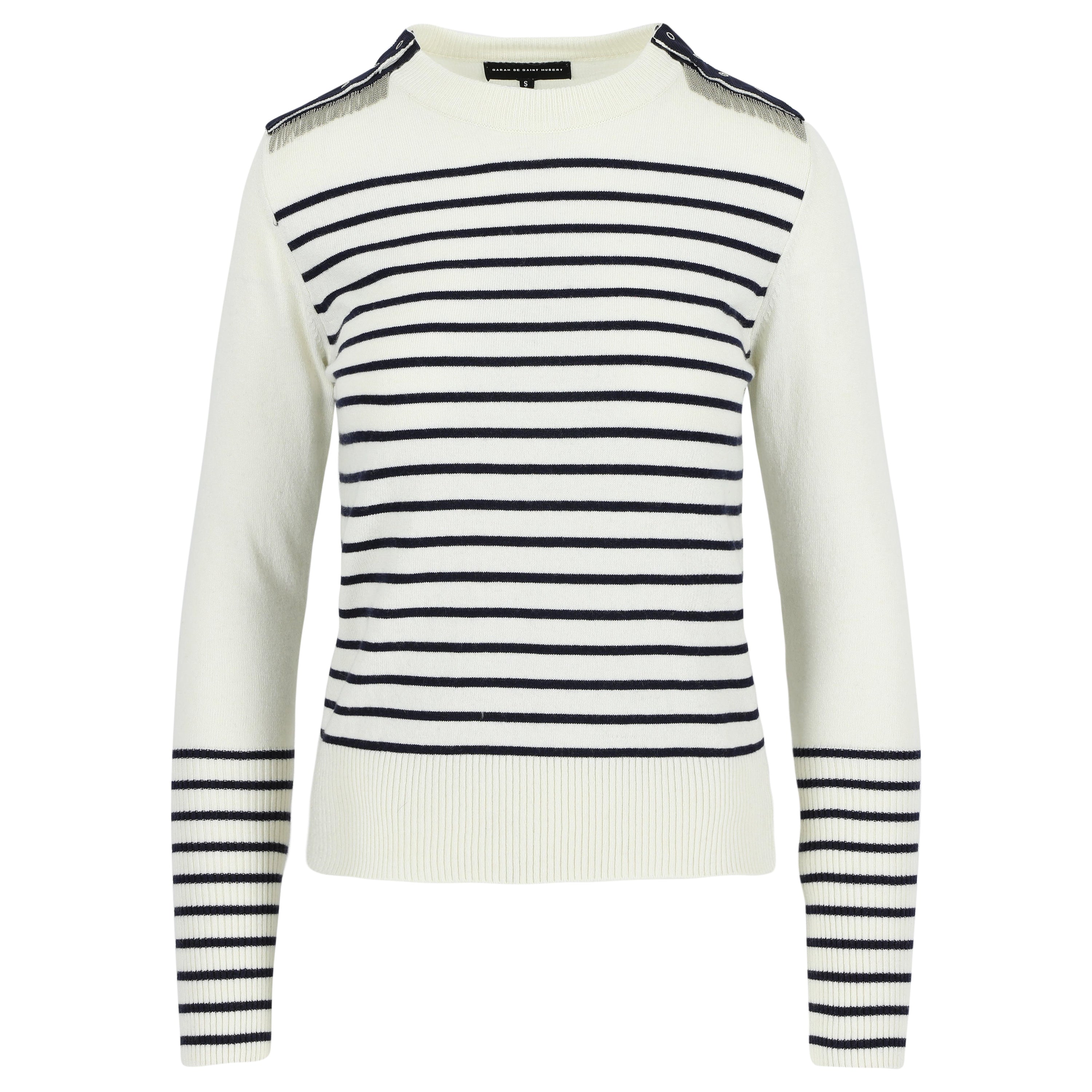 ISA is our classic crew neck jumper, featuring our signature hand-embroidered chains at the shoulders, together with gros-grain tape and press buttons.