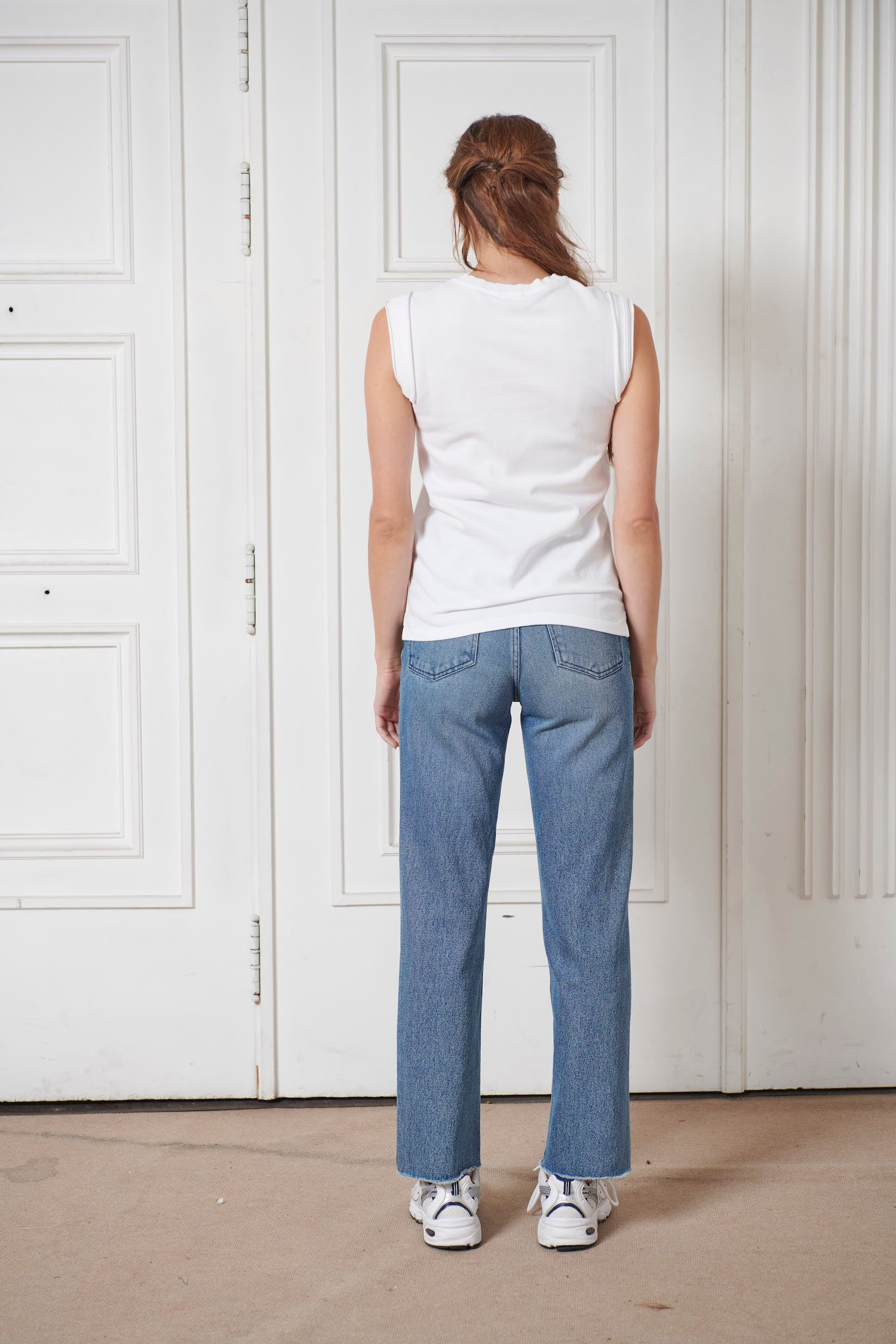 Women's white piqué polo shirt with iconic ribbed trim details. Straight fit. White satin applications around the armholes. 100% cotton jersey. Made in portugal