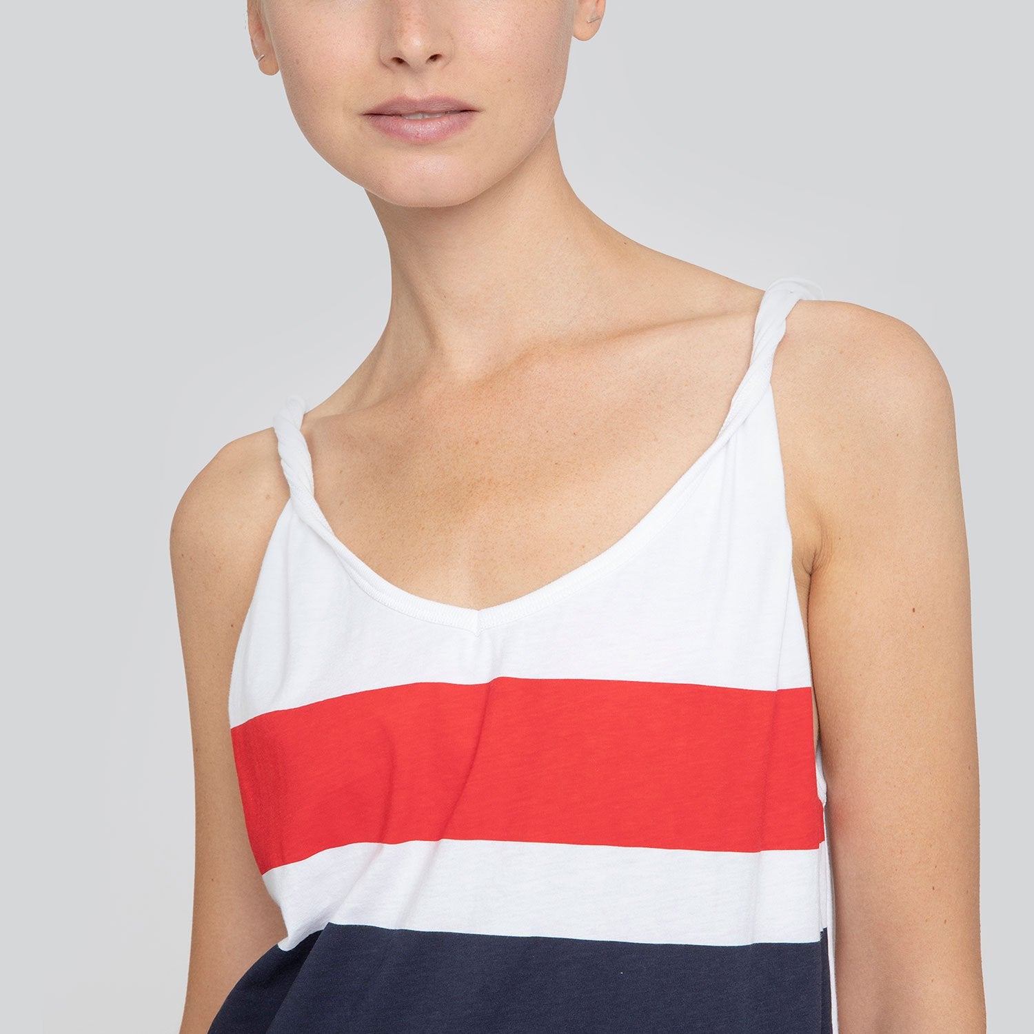 SARAH DE SAINT HUBERT white printed red/navy stripes tank top made of cotton jersey with twisted shoulder straps and v-neck line. A timeless piece.