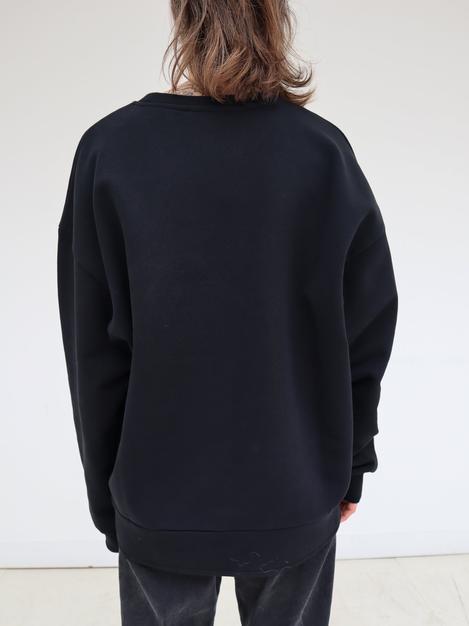 Signature Sweatshirt featuring our iconic 'broderie anglaise' at the front. Hand-Embroidered in BELGIUM with small pearls at the front (perles de cultures, 'grains de riz'). Relaxed fit, dropped shoulders. 100% black cotton. Made in Portugal, embroidered in Belgium other sizes available on demand