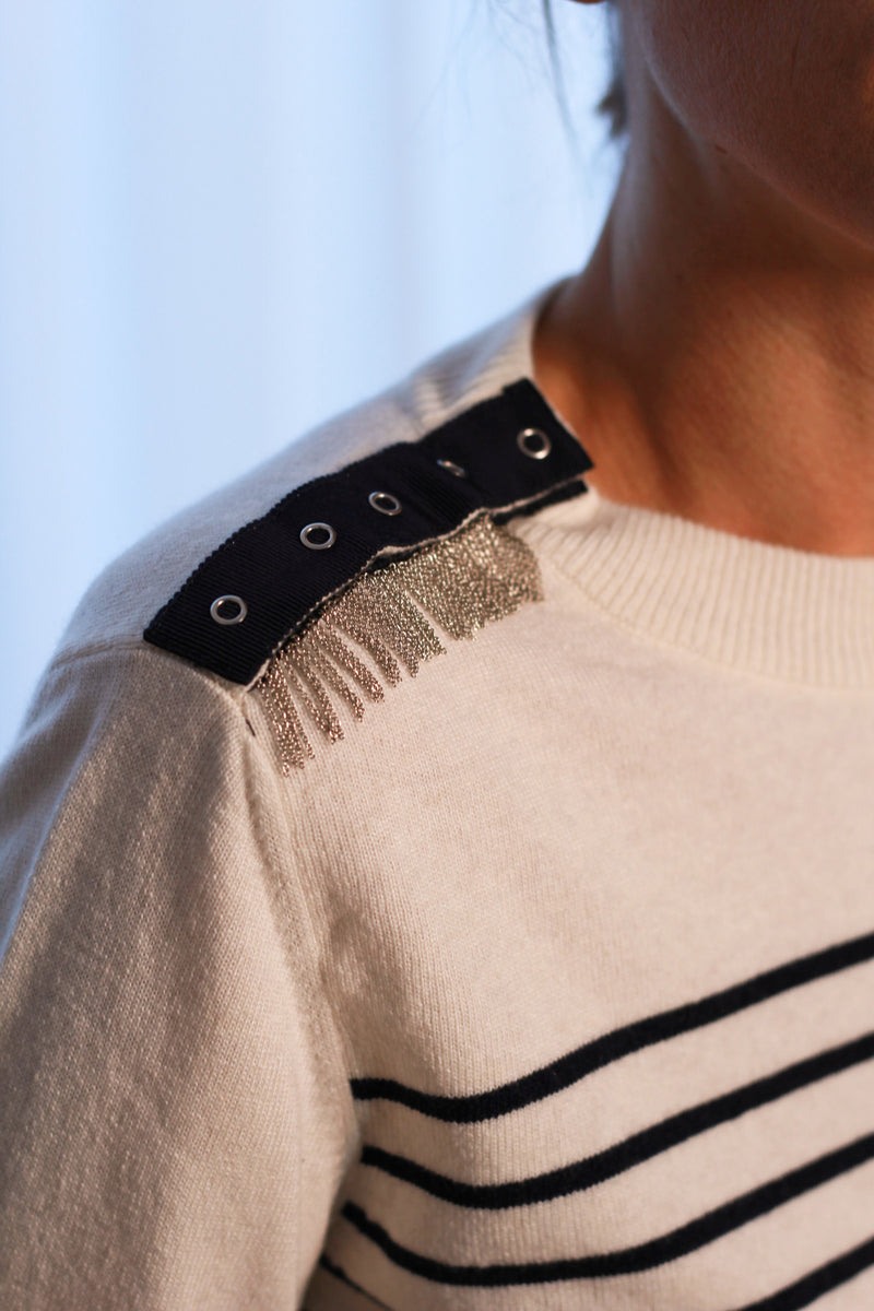 ISA is our classic crew neck jumper, featuring our signature hand-embroidered chains at the shoulders, together with gros-grain tape and press buttons.