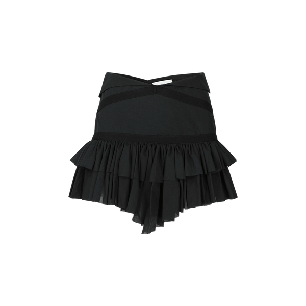 Jupe portefeuille noire à volants SARAH DE SAINT HUBERT, faite en coton. Silhouette féminine.