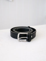 A classic black leather belt as a versatile accessory.