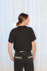 LOU is crafted in 100% Egyptian organic cotton jersey. This black T-shirt features a straight fit and short sleeves for a timeless silhouette. The signature hand-embroidered chain inserts adorn the front side, adding a bold yet refined edge. Designed in a straight fit, it’s true to size—size up if you prefer a looser look. Produced in Portugal in limited quantities.