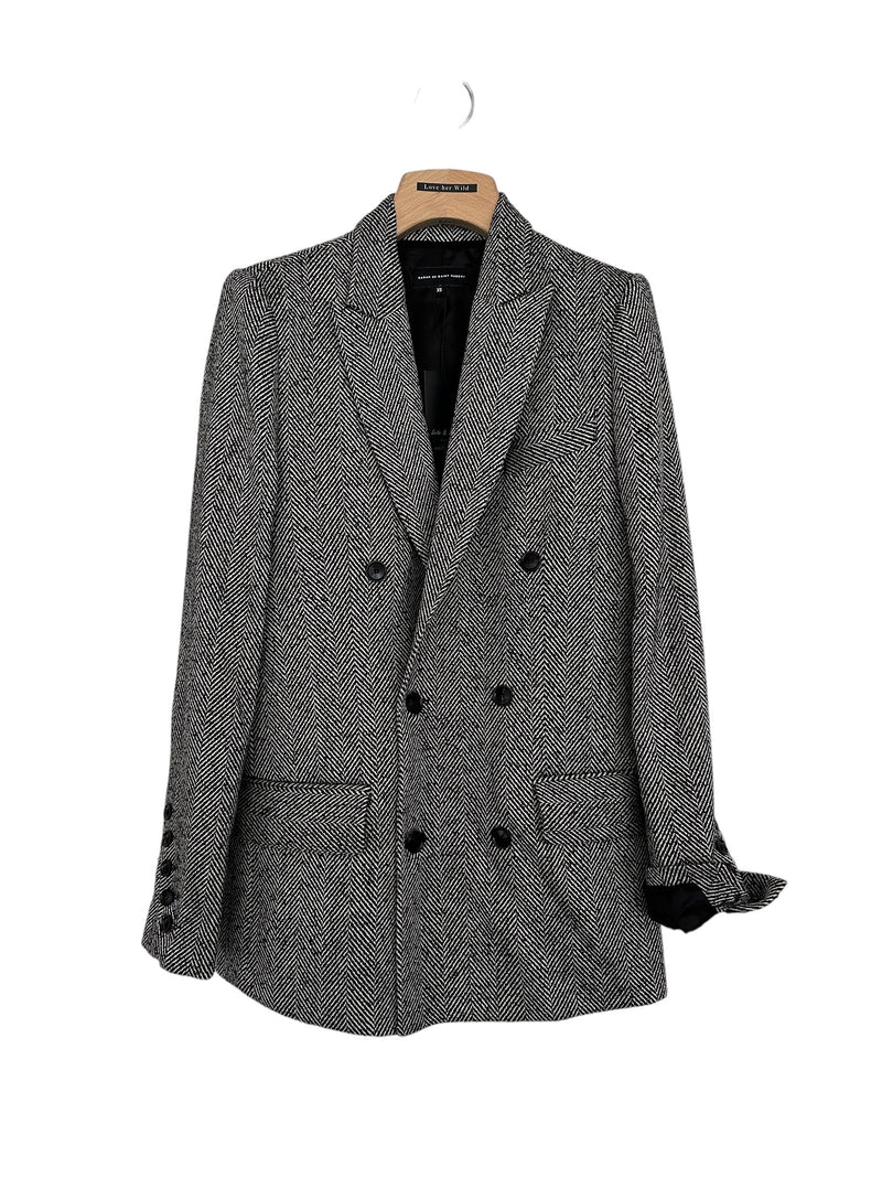Tailored double breasted boyfriend jacket for women in chevron woven wool, featuring a lapel collar and 2 front pockets. Signature diagonal buttoned cuffs. Made in limited edition in Portugal.