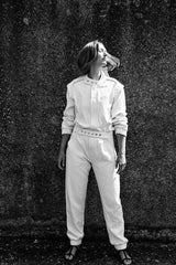 SARAH DE SAINT HUBERT Heritage racing jumpsuit with SDSH signature details. Beautiful silk-hemp fabric sourced from a Luxury House deadstock. Beige gros-grain finishings. Iconic rows of metal snaps at the collar and waist. Boyish and feminine look. Straight and relaxed fit. Made in Portugal