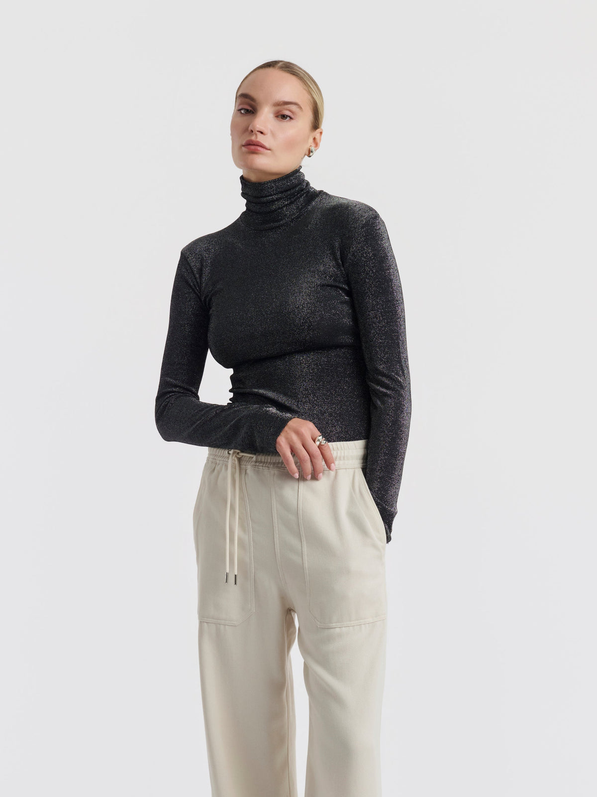Black and silver ELISABETH lurex roll neck top worn, front view