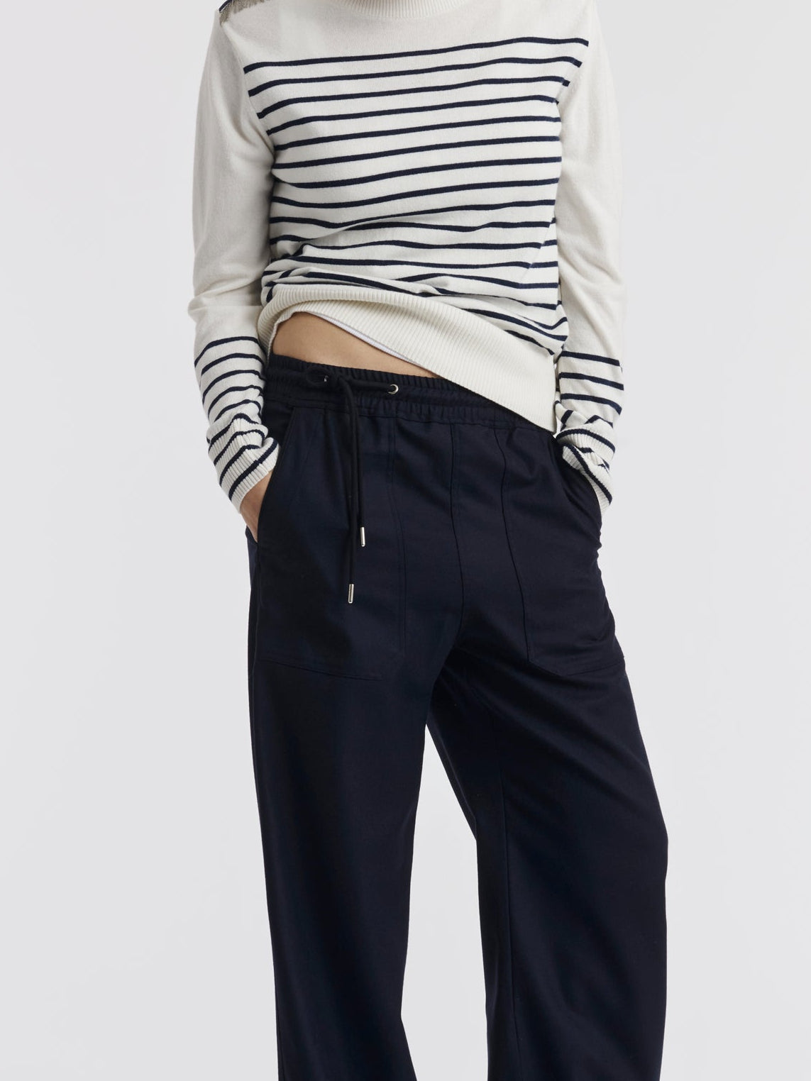 Black drawstring and grosgrain-edged pocket of the VIC trousers