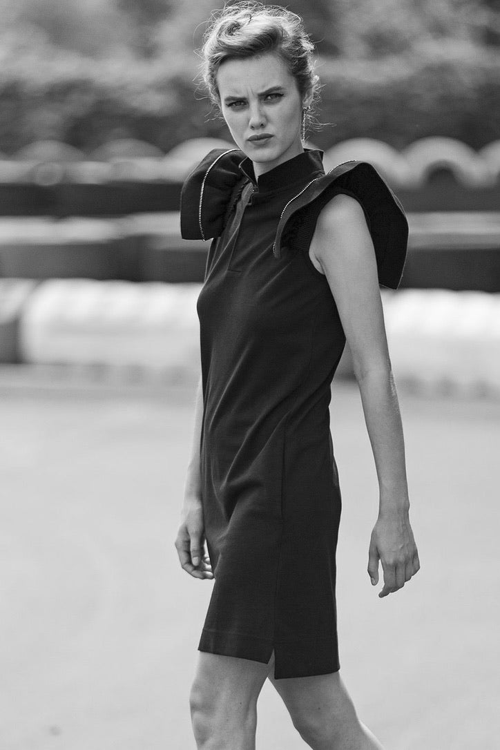 SARAH DE SAINT HUBERT black piqué polo shirt dress made of cotton with iconic ribbed butterfly sleeves. Feminine silhouette.