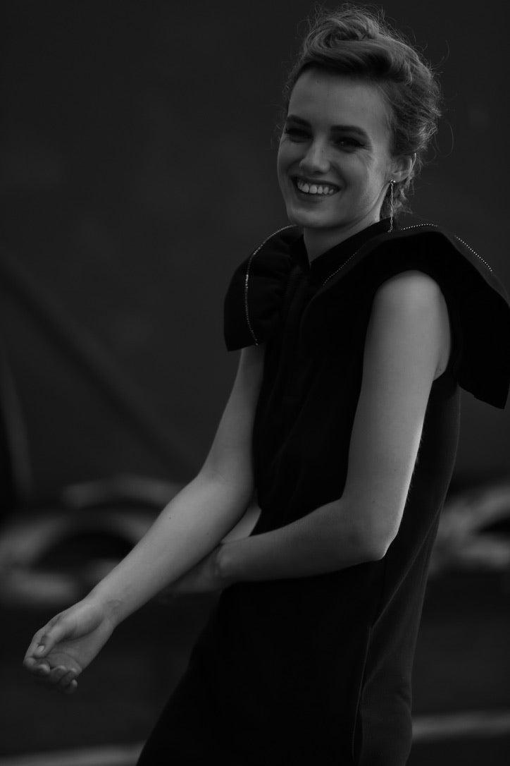 SARAH DE SAINT HUBERT black piqué polo shirt dress made of cotton with iconic ribbed butterfly sleeves. Feminine silhouette.