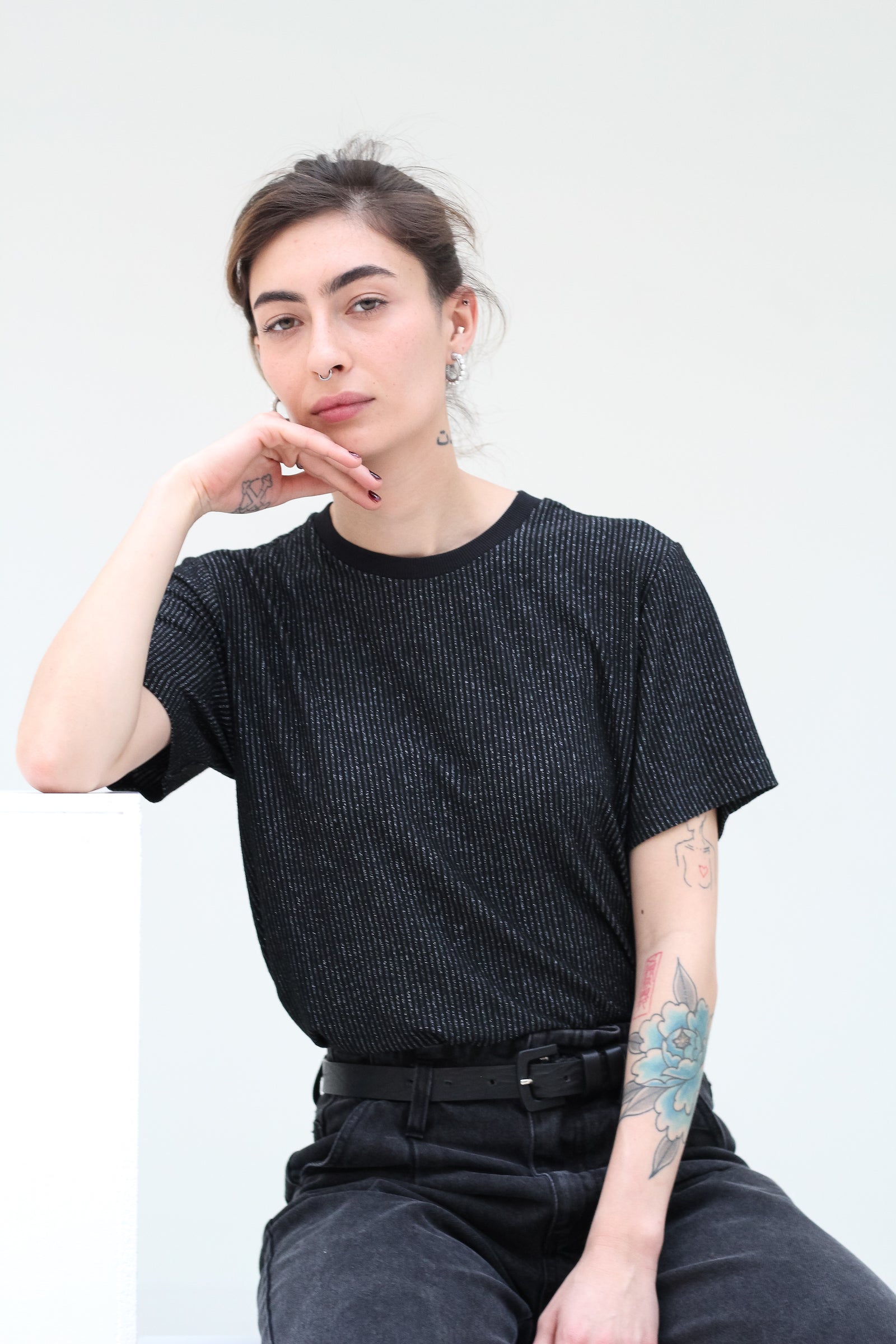 Deluxe jersey T-shirt with thin lamé silver stripes.  Straight & relaxed fit and crew neck line. 100% grey viscose jersey with vertical silver lamé stripes. Made in Portugal
