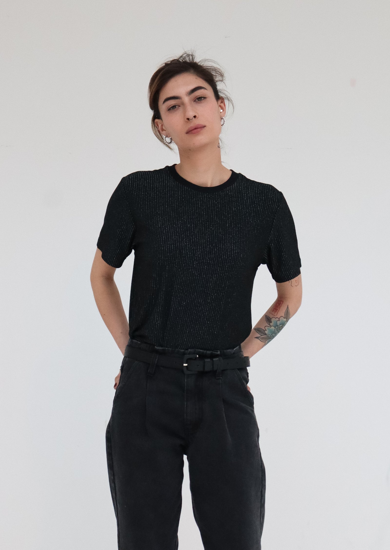Deluxe jersey T-shirt with thin lamé silver stripes.  Straight & relaxed fit and crew neck line. 100% grey viscose jersey with vertical silver lamé stripes. Made in Portugal
