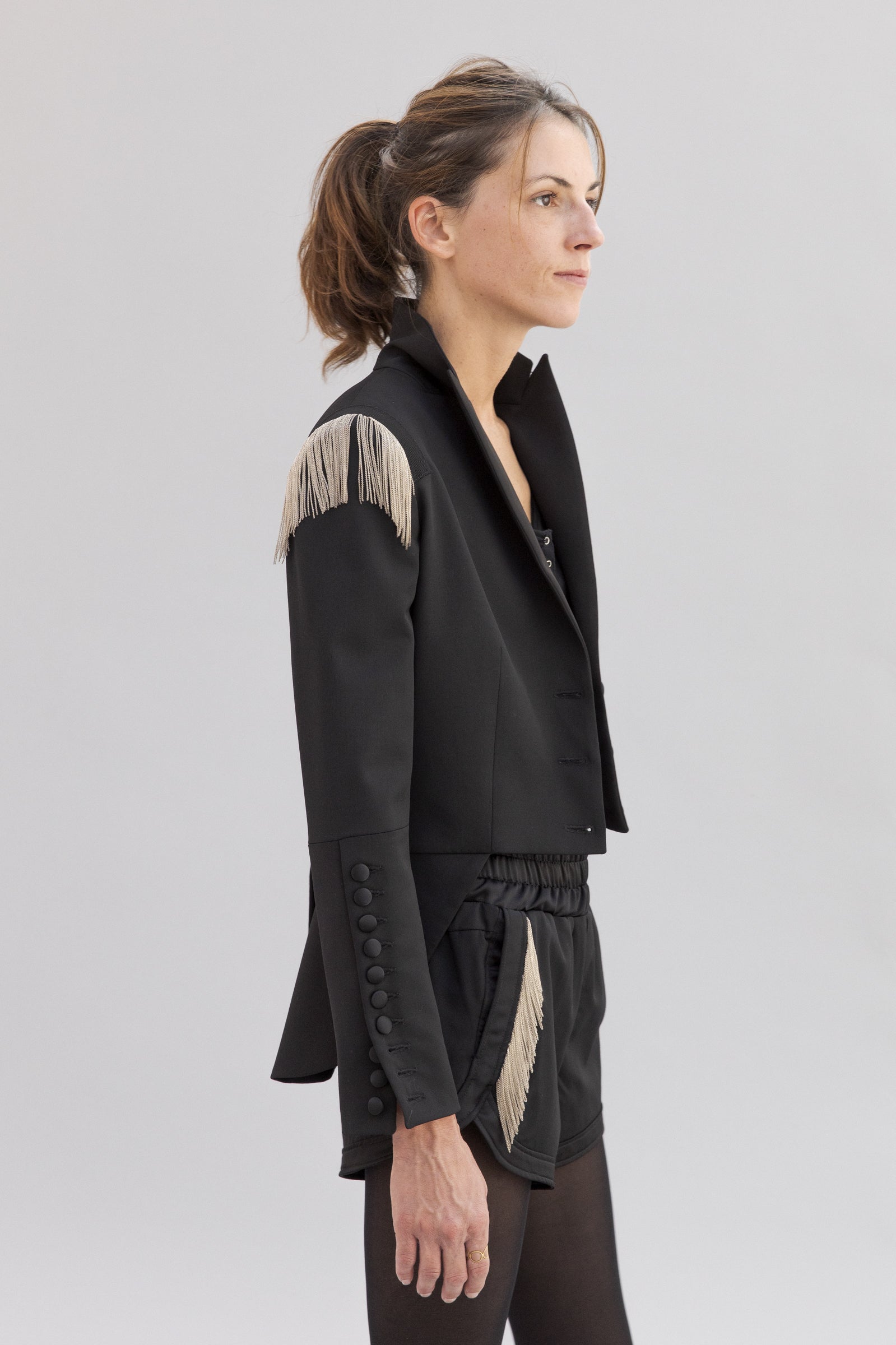 SARAH DE SAINT HUBERT satin black jacket made of virgin wool with hand embroidered chains. Feminine rock’n’roll silhouette. 