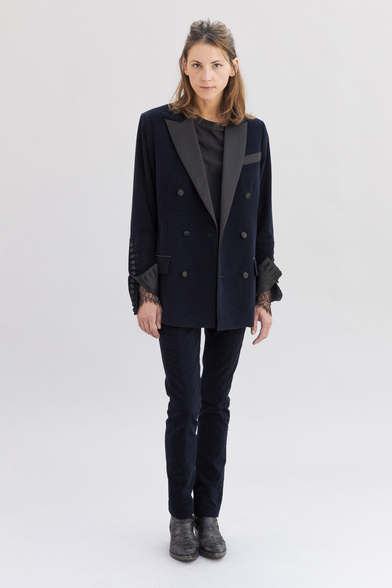 SARAH DE SAINT HUBERT navy double breasted boyfriend tailored jacket of ribbed velvet with signature extra-high buttoned cuffs with satin covered buttons. Boyfriend and straight fit.