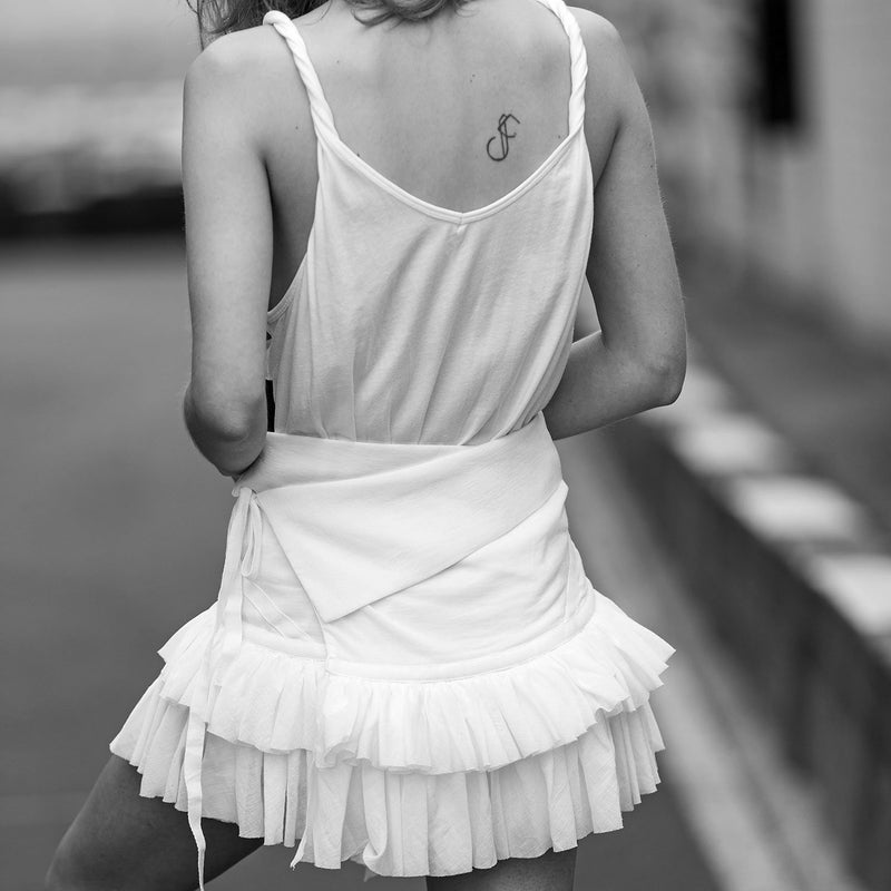 SARAH DE SAINT HUBERT white voile wrap ruffle skirt made of coton. Feminine silhouette.