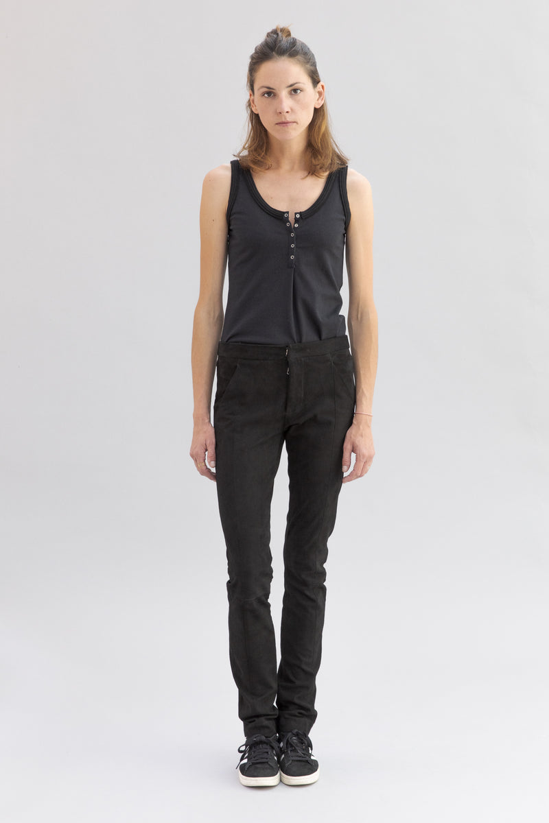 SARAH DE SAINT HUBERT black tank top made of jersey with polo rib border details and press buttons placket at frontside. A timeless feminine basic with a straight fit.