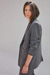 SARAH DE SAINT HUBERT grey double breasted boyfriend tailored jacket of light virgin wool with signature diagonal buttoned cuffs opening. Boyfriend and straight fit.